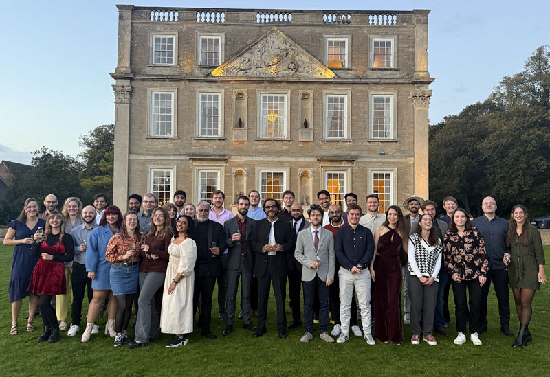 The Greyparrot team is gathered outside a country house