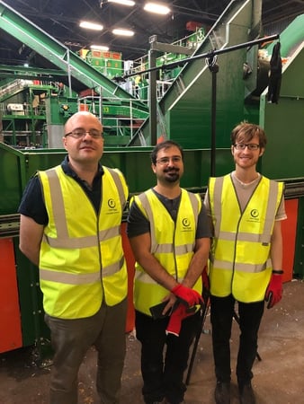 Three proud-looking Greyparrot employees