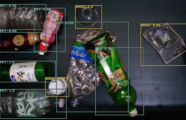 Various plastic items being scanned for identification and sorting