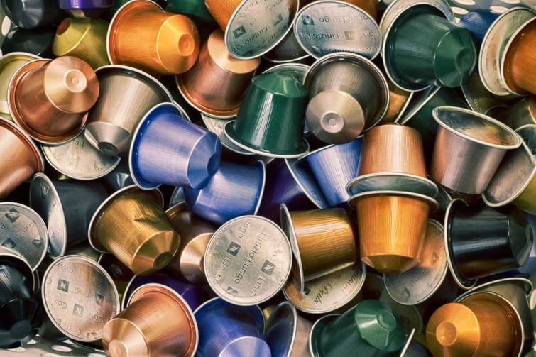 A pile of aluminium coffee pods