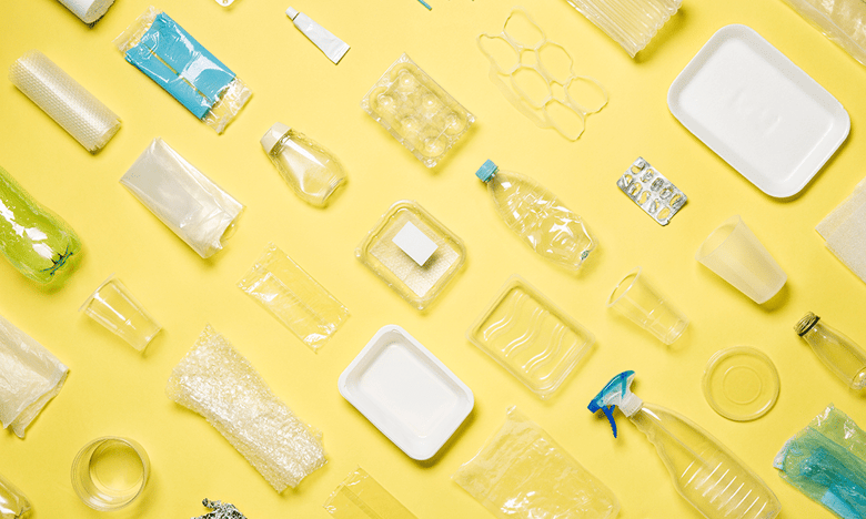 Empty plastic containers on a yellow background